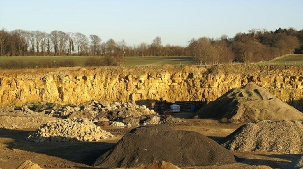 Collyweston Quarry — near Collyweston and Duddington in northeastern Northamptonshire. Originally quarried for Collyweston slate roof material (limestone shingles). A face of Jurassic limestone forms the back wall of this quarry which today mainly houses sand and gravel.
