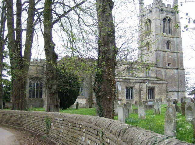 All Saints' Church, Easton-on-the-Hill The church is prominent on the hill but surrounded by trees.