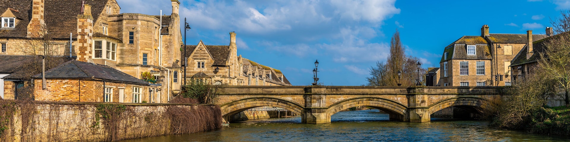 A view along the River Welland towards Stamford Bridge in Stamford, Lincolnshire, UK in springtime