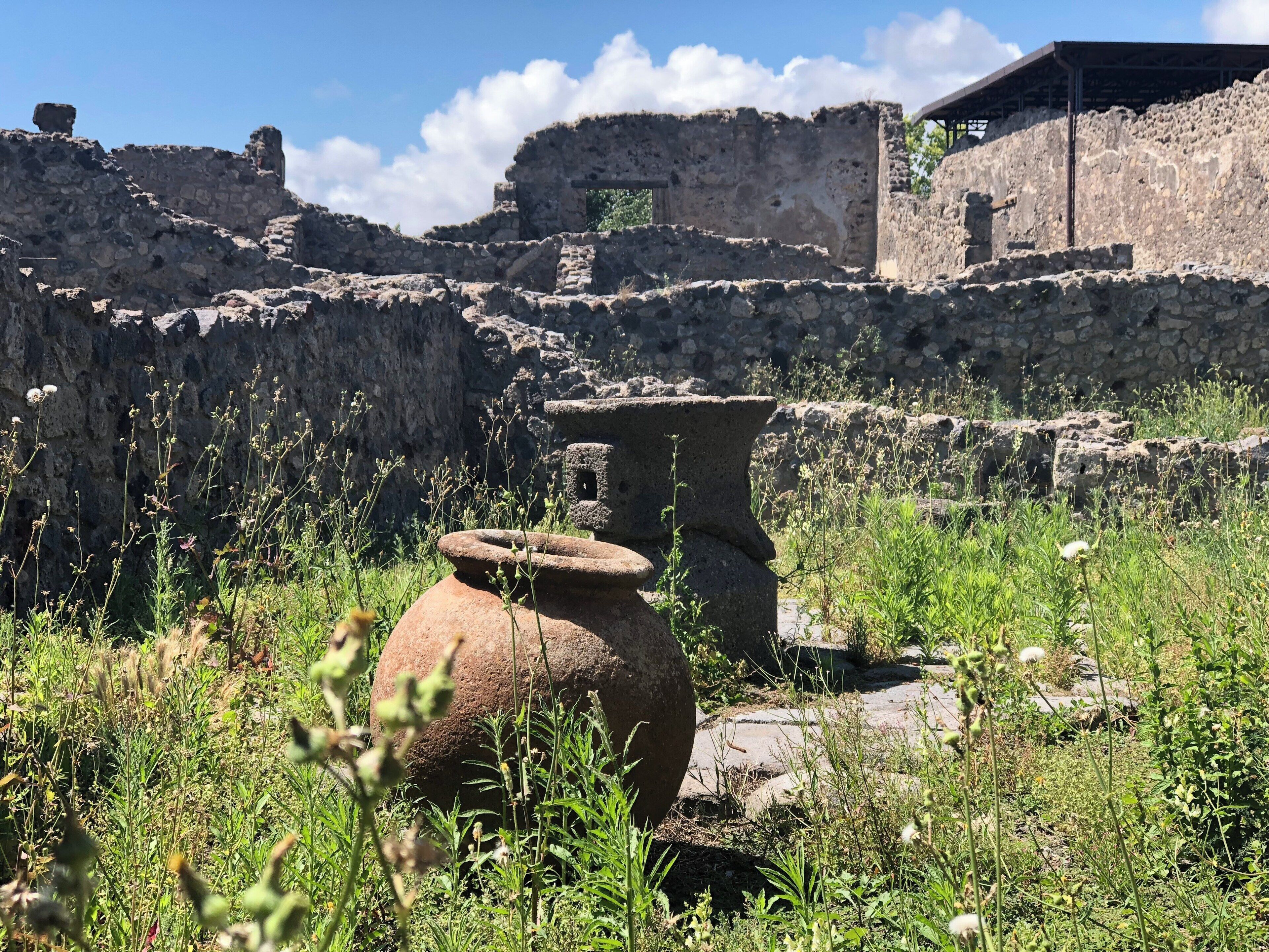 Ancient vessels sit amongst ruins in Pompeii. An unbelievable place to visit!