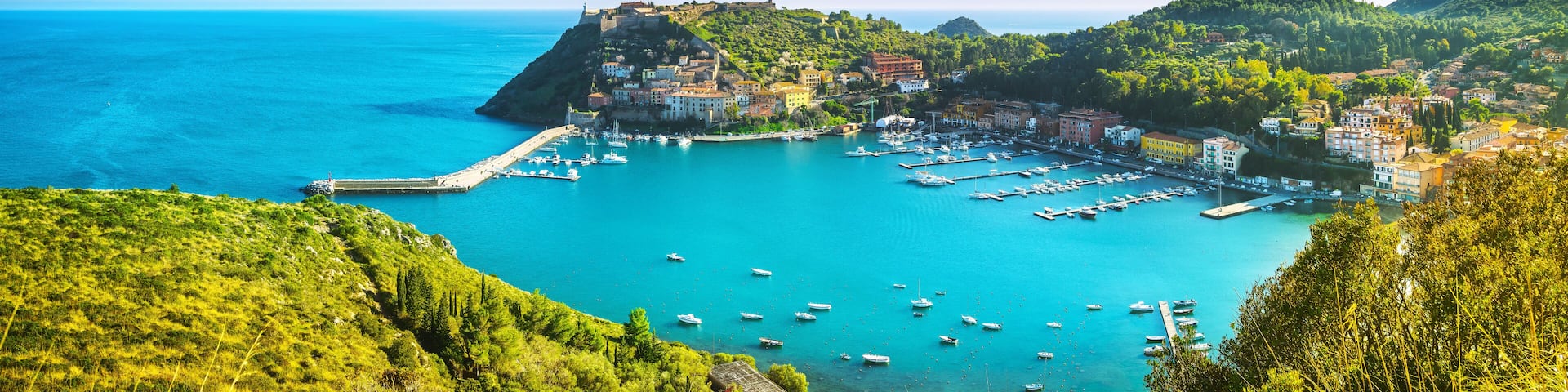 Porto Ercole village and harbor in a sea bay. Aerial view, Argentario, Tuscany, Italy