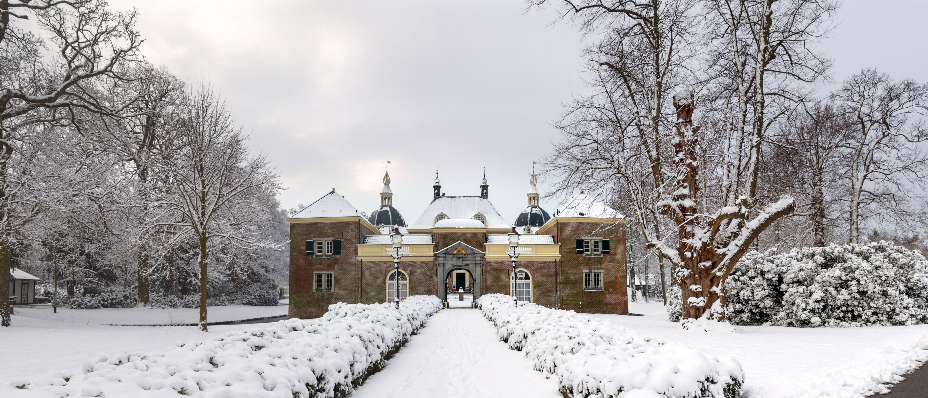 Red brick Endegeest castle in winter, Netherlands