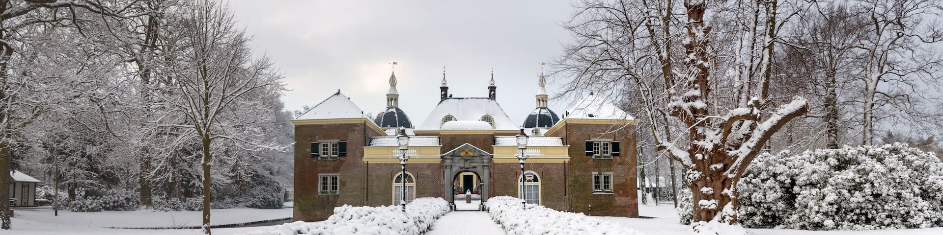 Red brick Endegeest castle in winter, Netherlands
