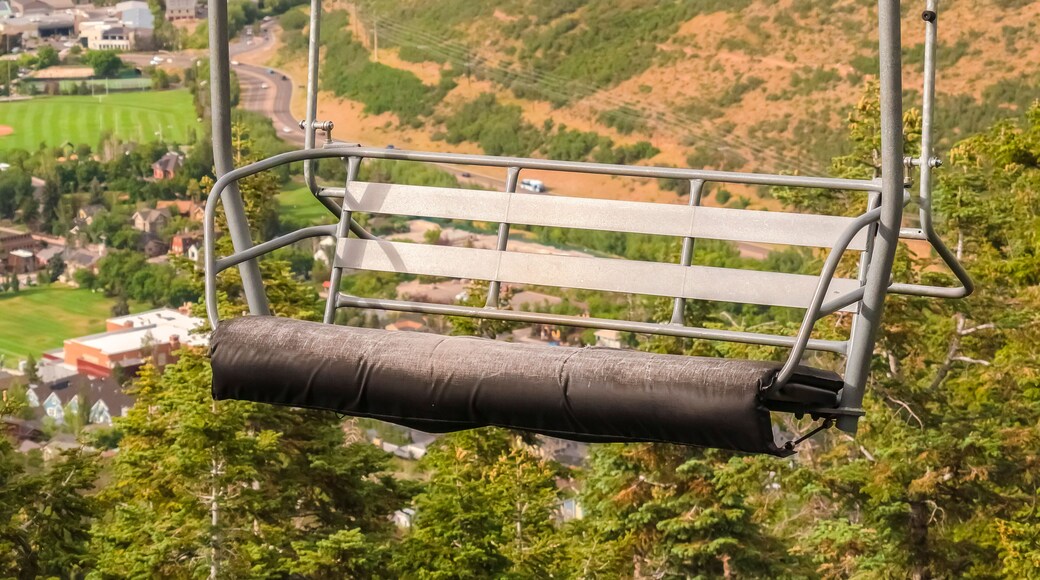 Panorama Close up of an empty chairlift overlooking Park City landscape during off season