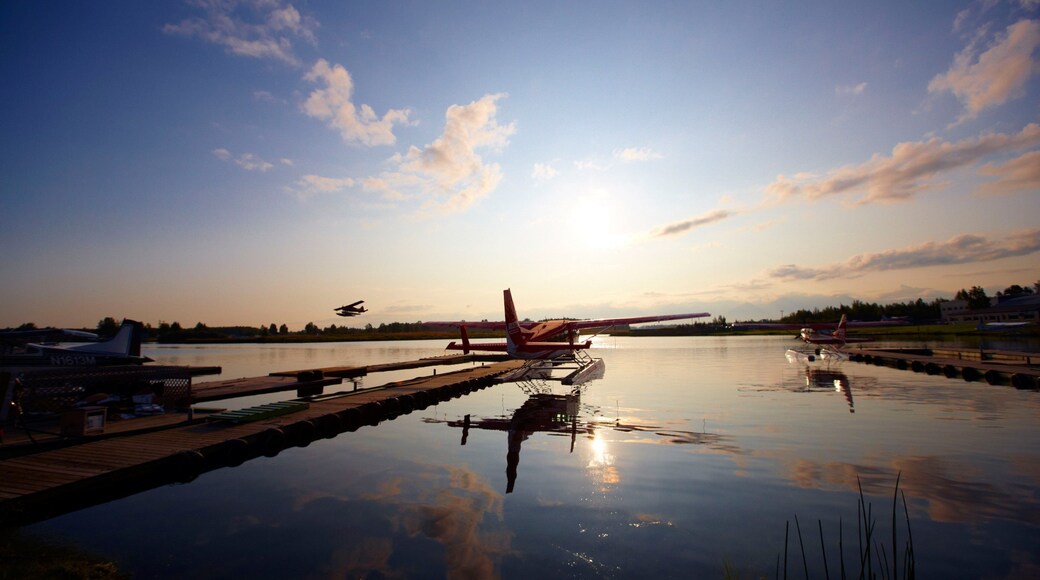 Kenai featuring a sunset, aircraft and a bay or harbor