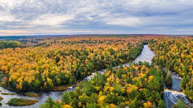 Autumn colors of Lower Tahquamenon Falls basin in Tahquamenon State Park in the Michigan Upper Peninsula - waterfall