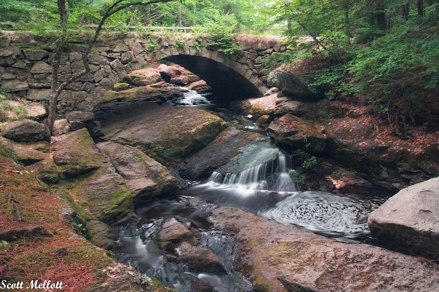 Beautiful old stone bridge over the small waterfall . . . .great swimming hole just downstream from the falls.