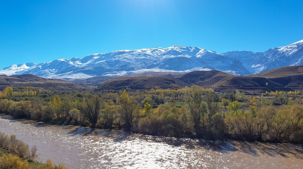 Panoramic view of a valley with snow capped mountains and River Euphrates near Erzincan, Turkey