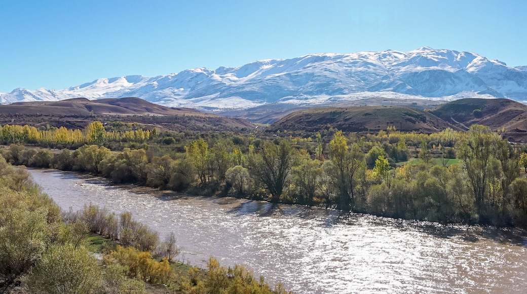 Panoramic view of a valley with snow capped mountains and River Euphrates near Erzincan, Turkey