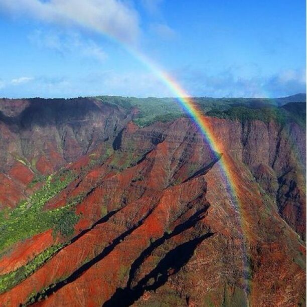 A canyon with a rainbow.