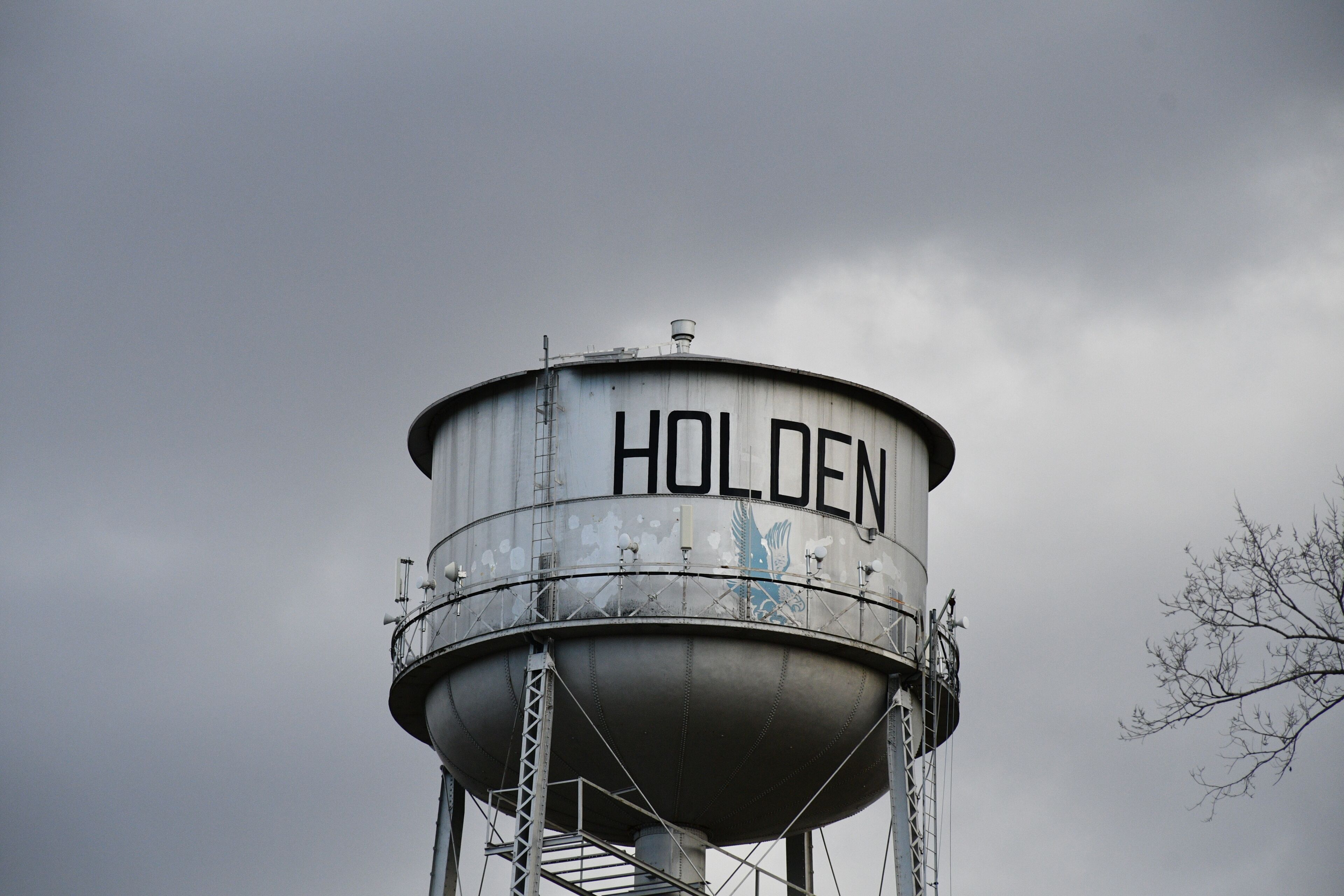 A water tower with the word 'HOLDEN' on it.