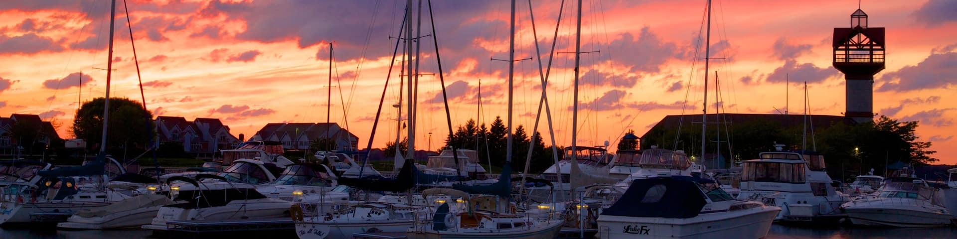 Erie featuring sailing, a sunset and a bay or harbor