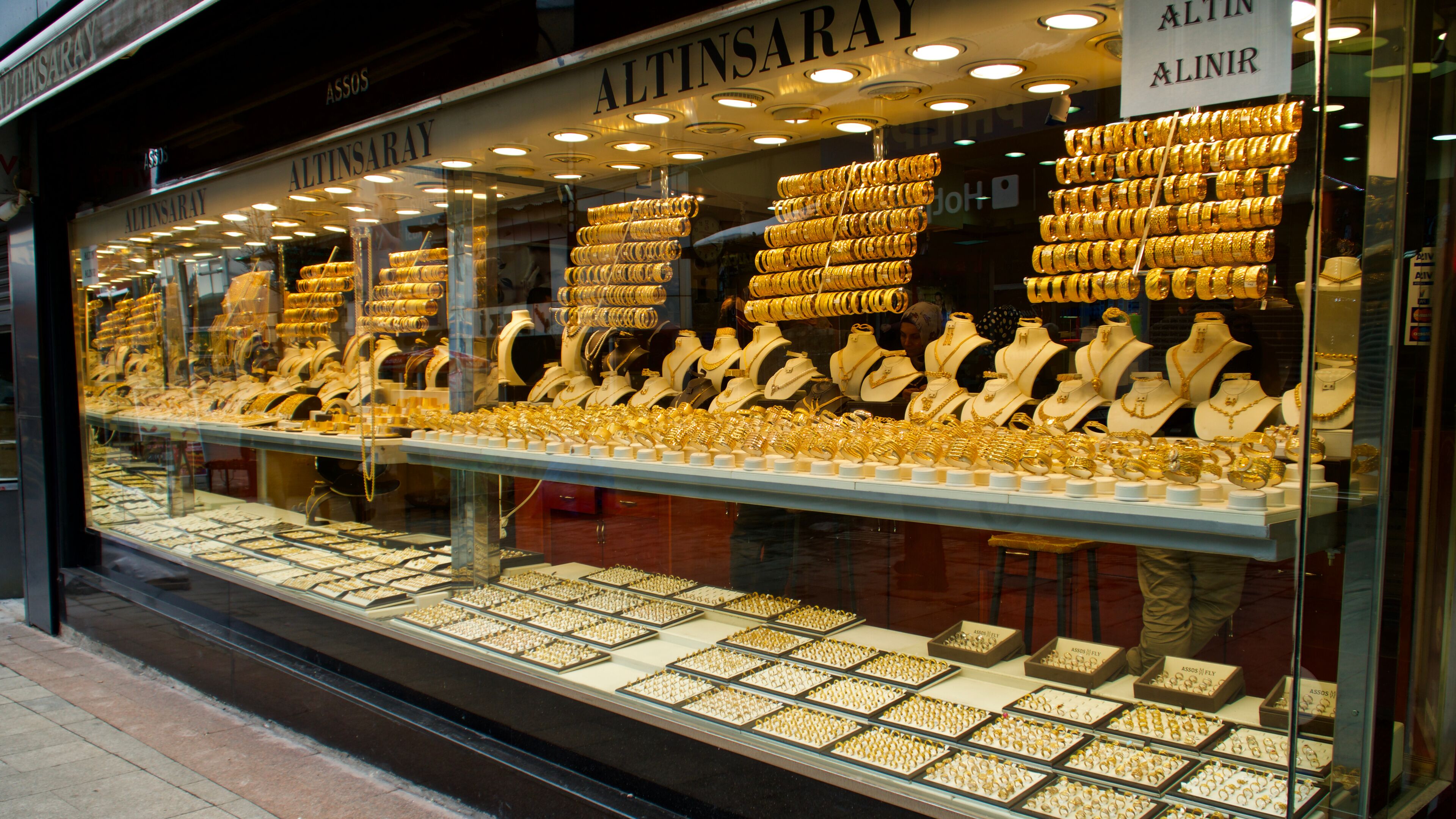 A jewelry store with a display of gold jewelry.