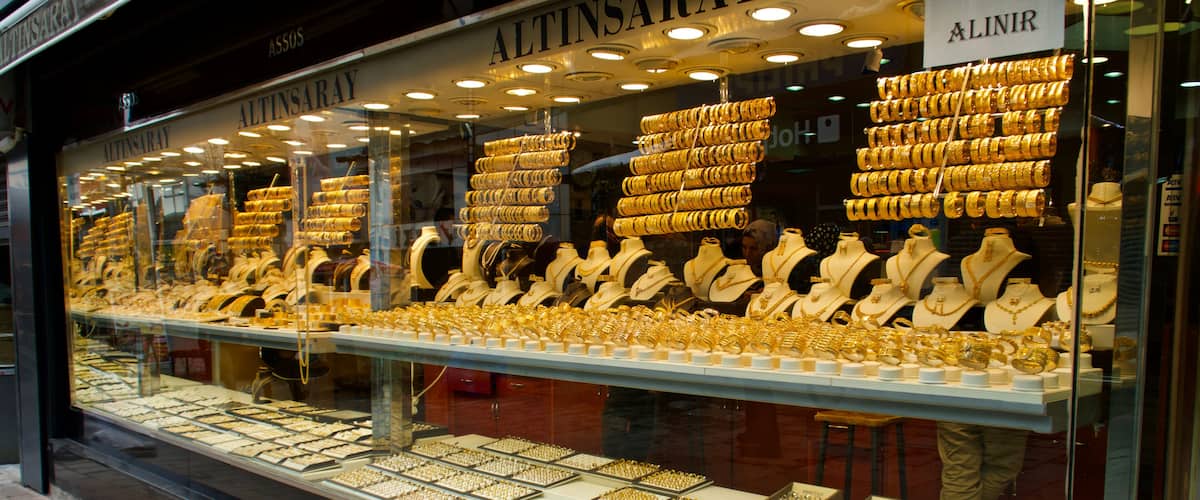 A jewelry store with a display of gold jewelry.