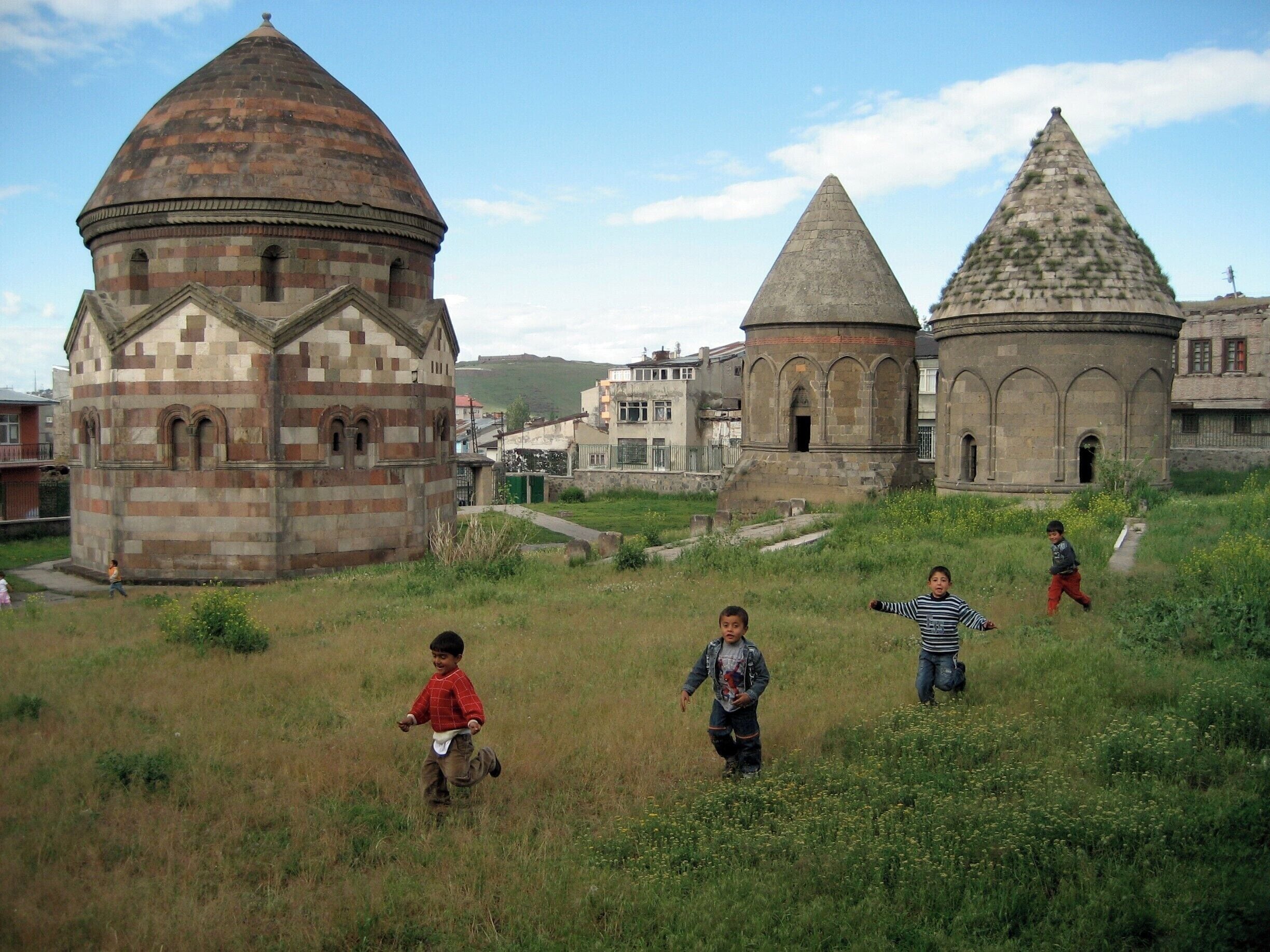 We were far away from the usual tourist paths of Turkey, heading towards the North-Eastern border. A horde of curious kids came running to see what we were doing. You will see real daily life around the Three Tombs area. #Turkey #Architecture