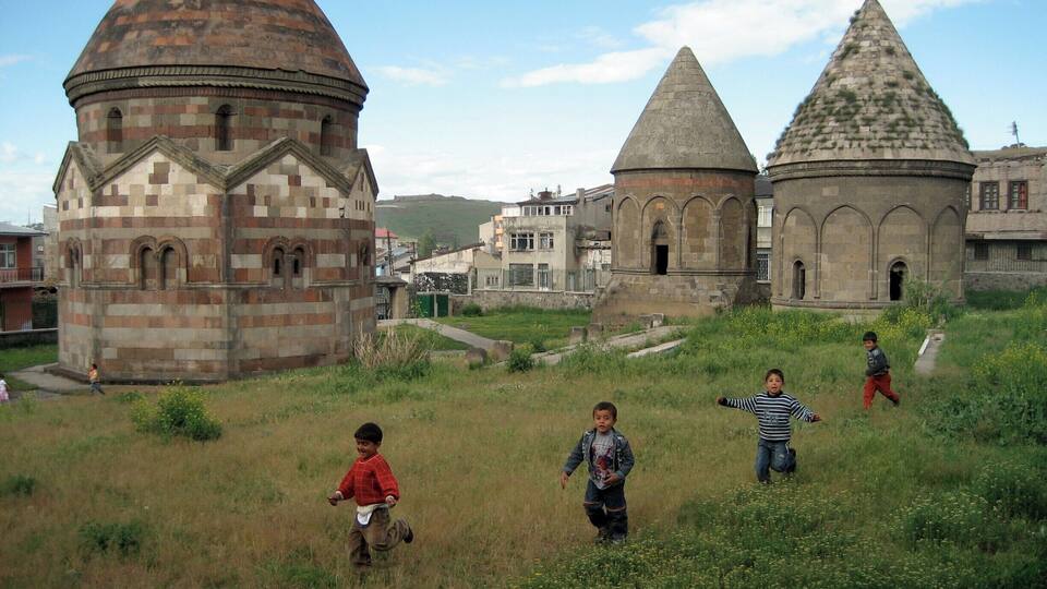 We were far away from the usual tourist paths of Turkey, heading towards the North-Eastern border. A horde of curious kids came running to see what we were doing. You will see real daily life around the Three Tombs area. #Turkey #Architecture