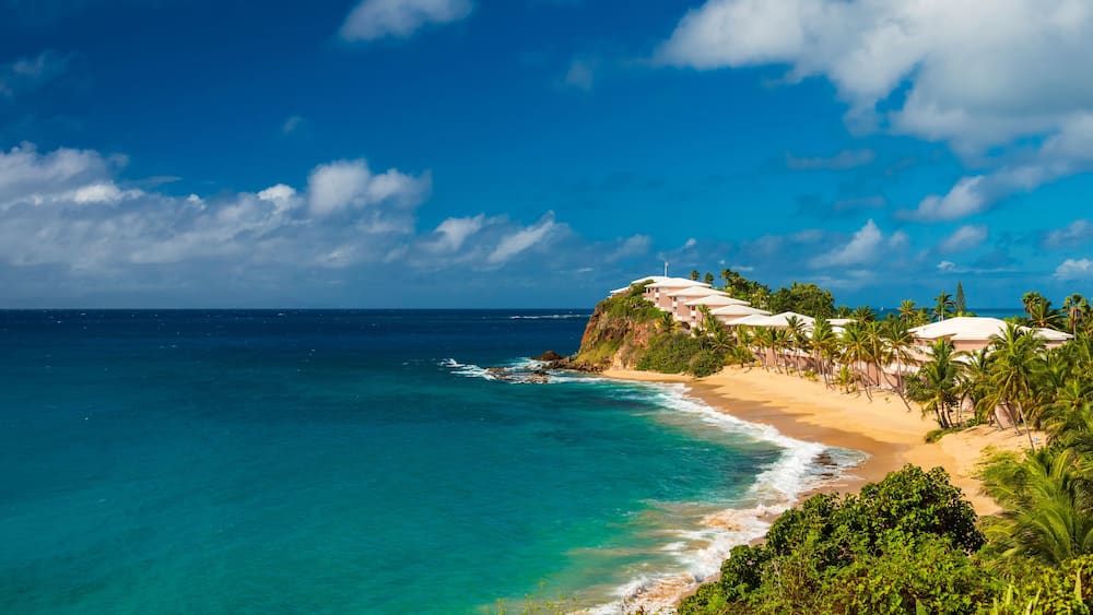 Serene golden sands and azure sea at Valley Church Beach, Antigua