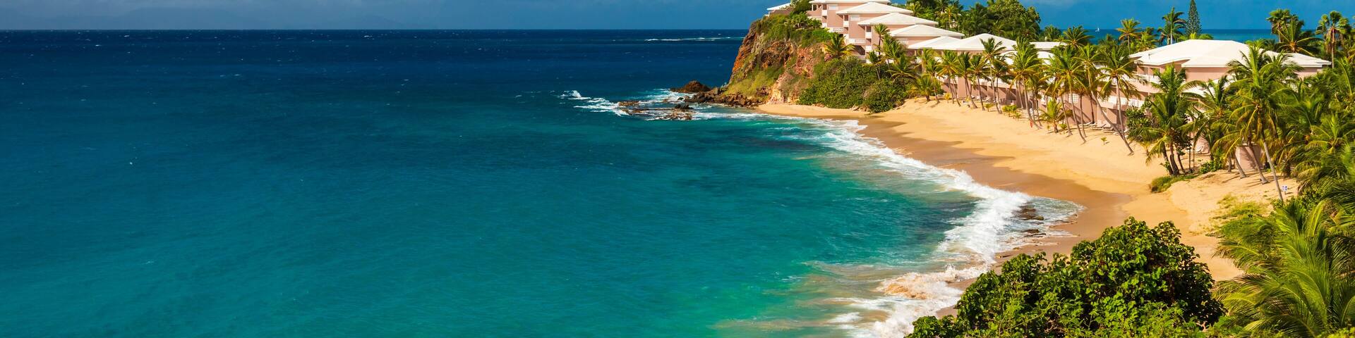 Serene golden sands and azure sea at Valley Church Beach, Antigua