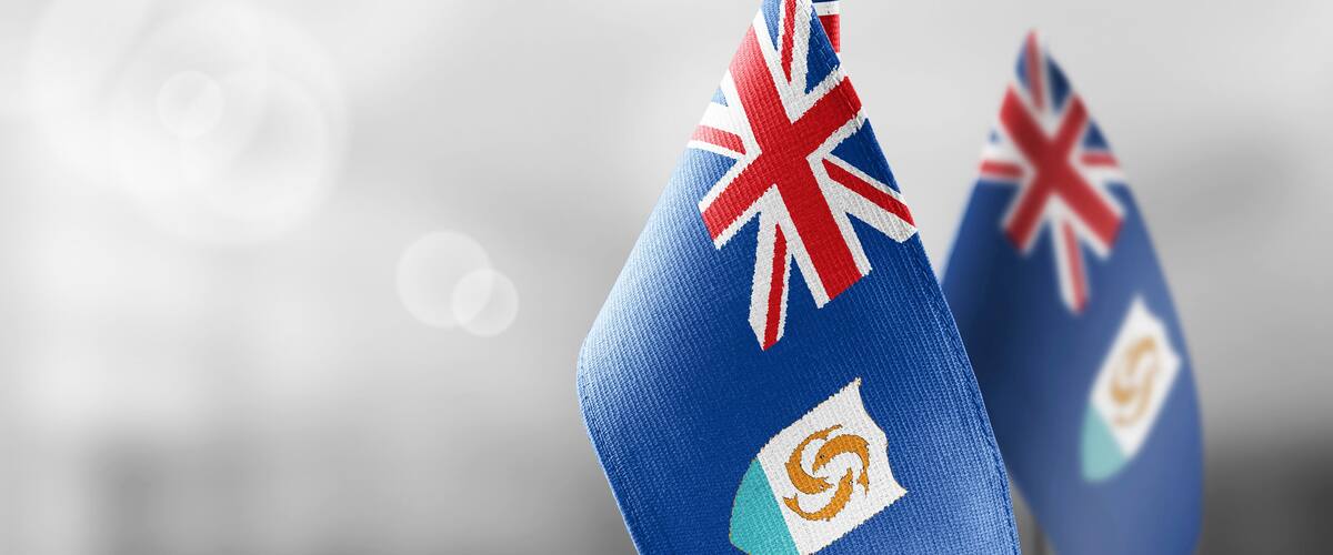 Two blue objects with flags and logos.