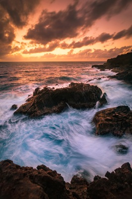 A cool bit of coastline on Aruba where you can catch the sunrise and watch the waves crash against the rocks. Just park at the light house and walk east to the cliffs. There's a small trail leading down to the water.