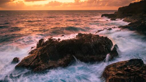 A cool bit of coastline on Aruba where you can catch the sunrise and watch the waves crash against the rocks. Just park at the light house and walk east to the cliffs. There's a small trail leading down to the water.