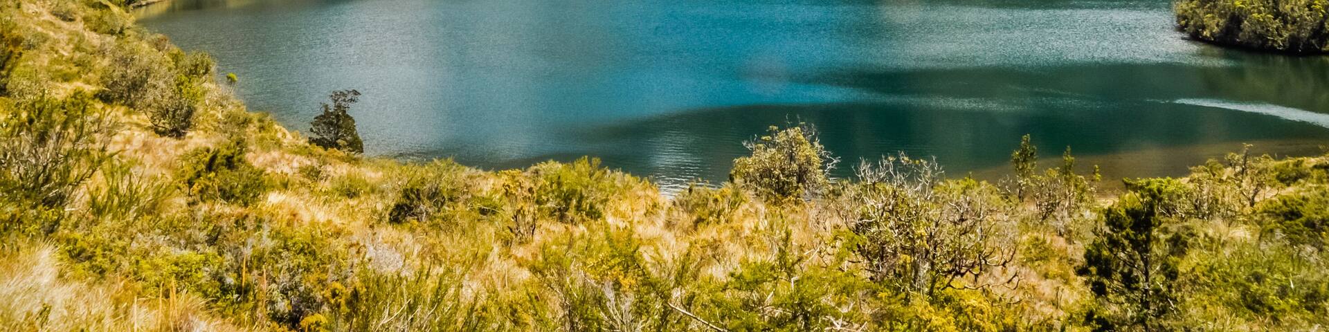 Lake surrounded by mountains and wilderness near Mount Wilhelm in Papua New Guinea. In this region, one can only meet people from isolated local tribes.; Shutterstock ID 543165721; purchase_order: -;