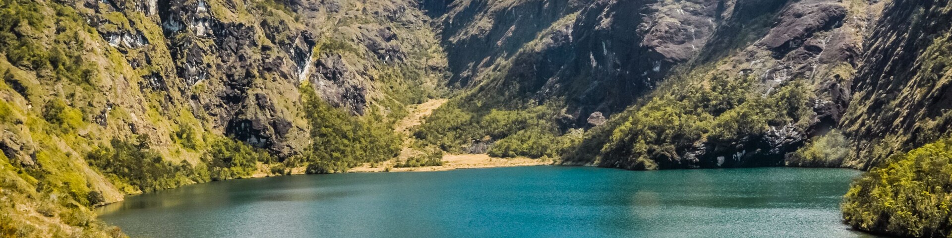 Lake surrounded by mountains and wilderness near Mount Wilhelm in Papua New Guinea. In this region, one can only meet people from isolated local tribes.; Shutterstock ID 543165721; purchase_order: -;