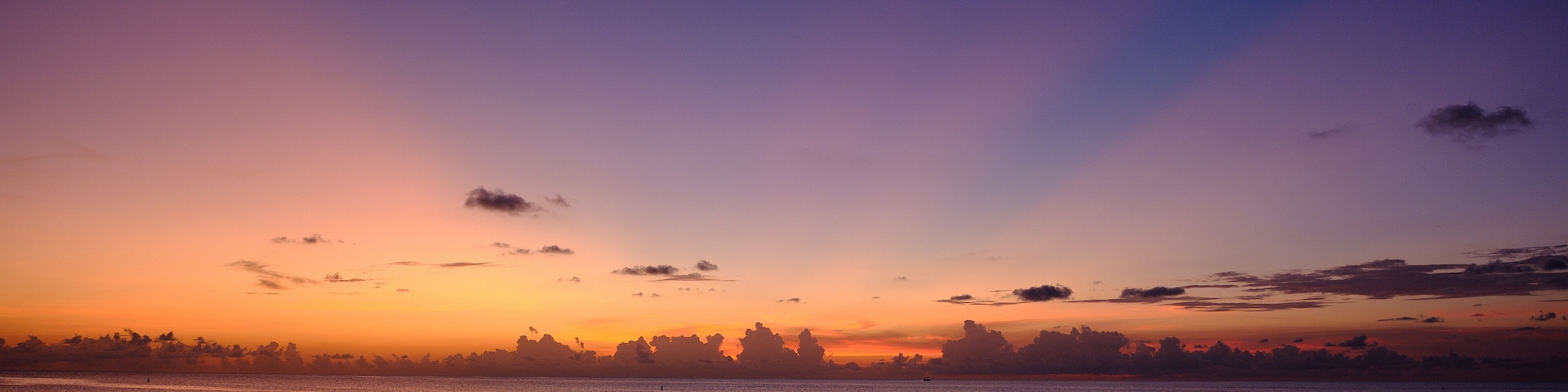 A perfect end of day sunset on the west side of the Cayman Islands on Seven mile beach British West Indies