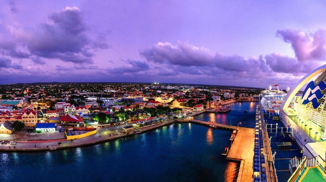 View of city against cloudy sky during sunset