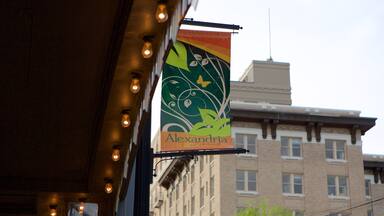 A building with a sign that reads "Alexandria" and a decorative banner with a leaf and butterfly design.