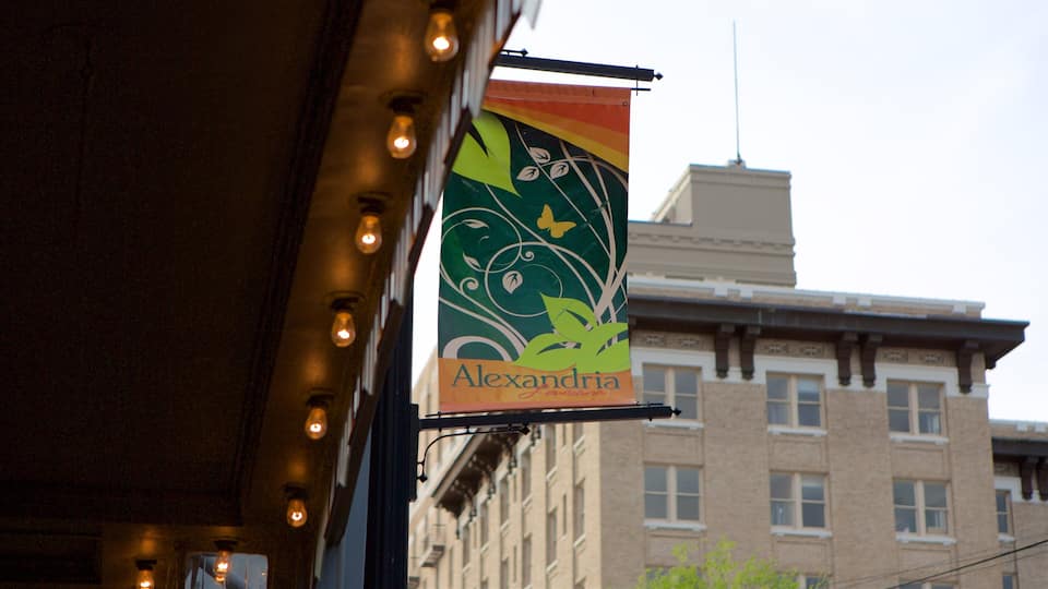 A building with a sign that reads "Alexandria" and a decorative banner with a leaf and butterfly design.