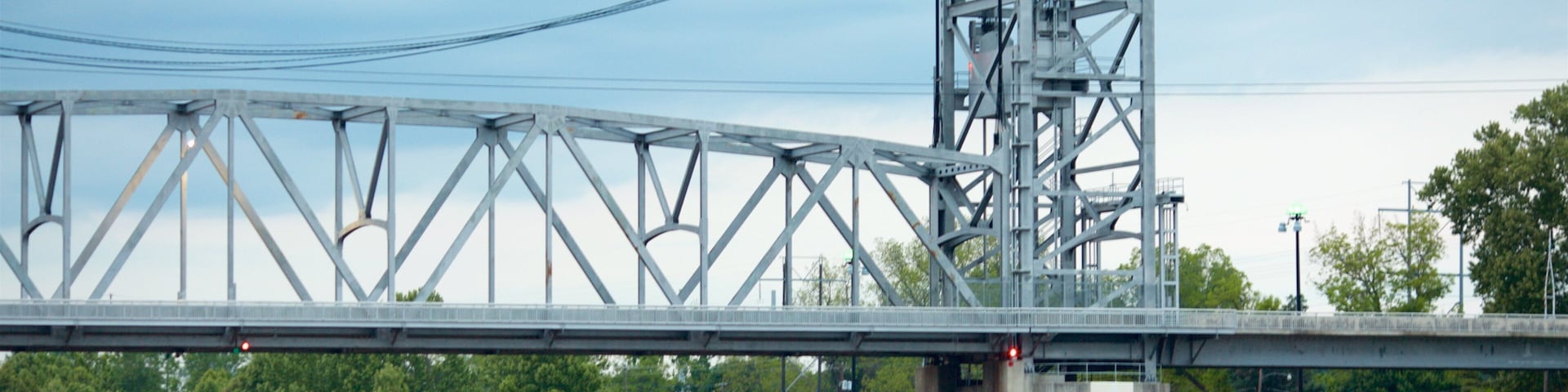 Alexandria featuring a river or creek and a bridge