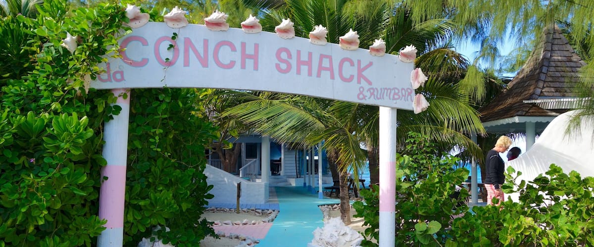 Conch Bar featuring signage, a bar and general coastal views