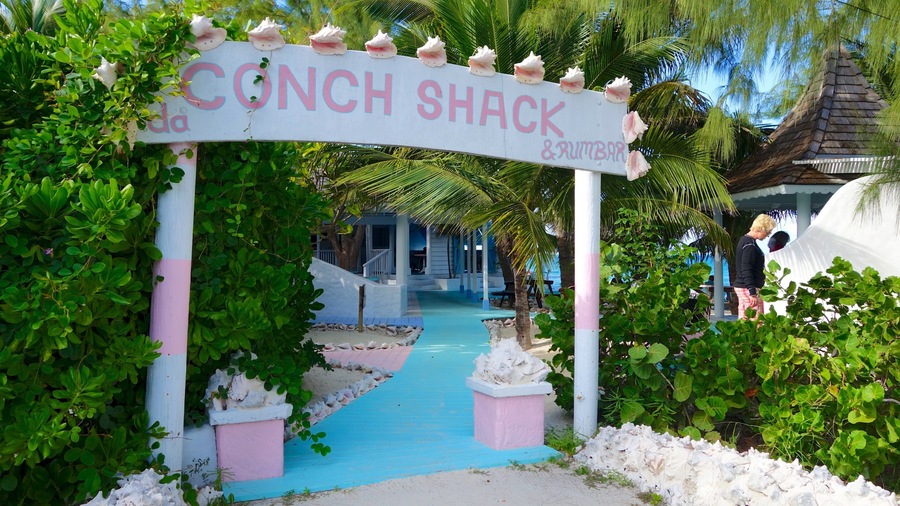 Conch Bar featuring signage, a bar and general coastal views