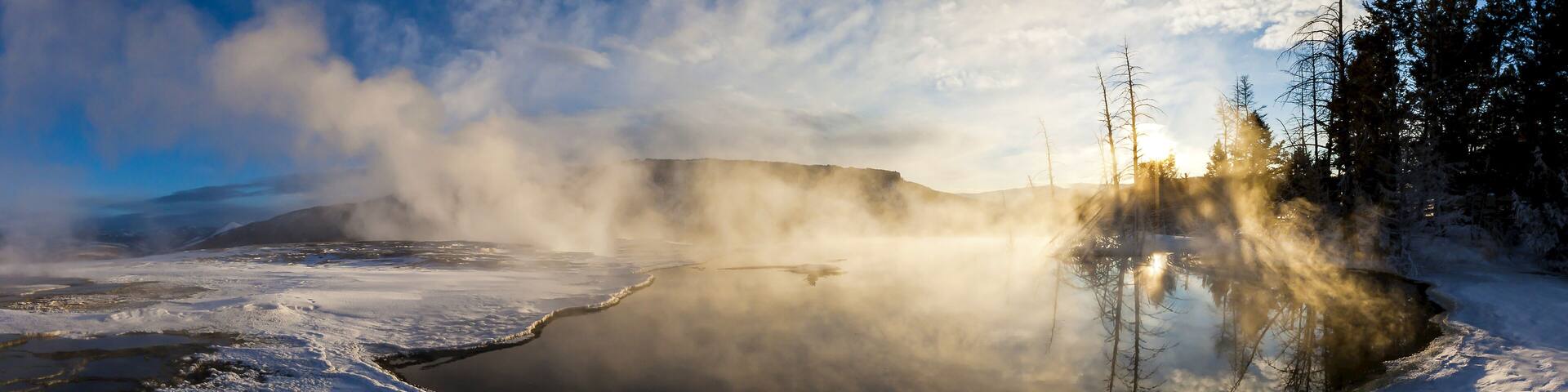 Steam rises from a natural hot spring.