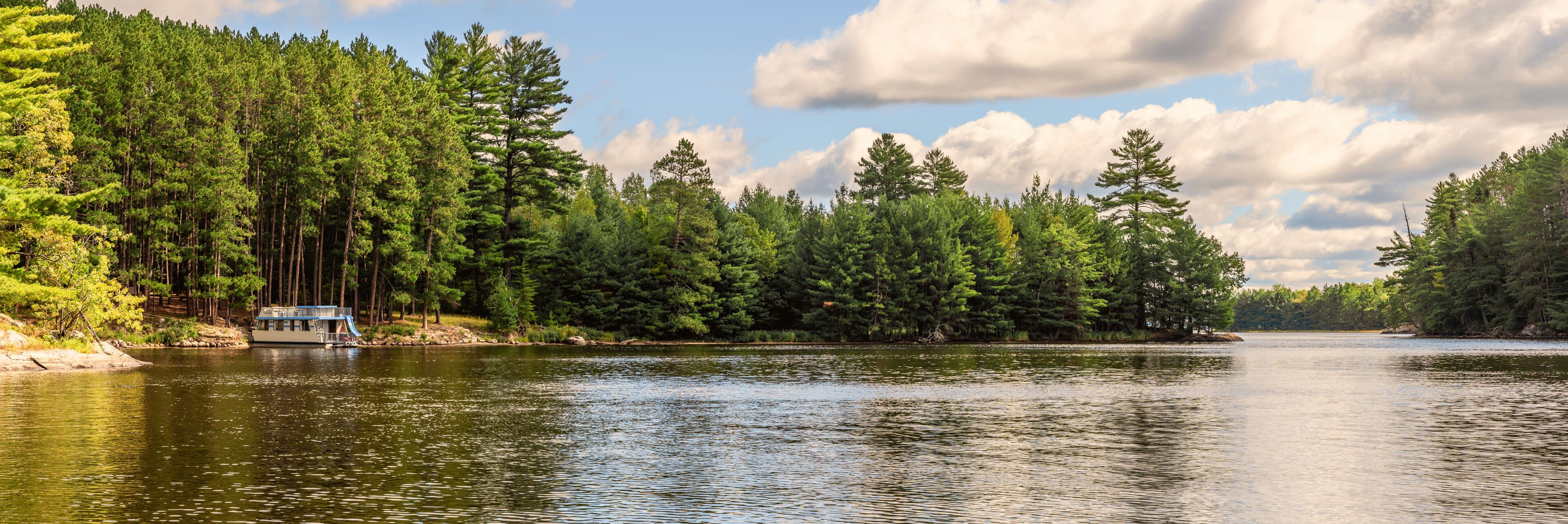 People are enjoying fishing and boating on a sunny day on Crane Lake, Voyageurs National Park, Minnesota