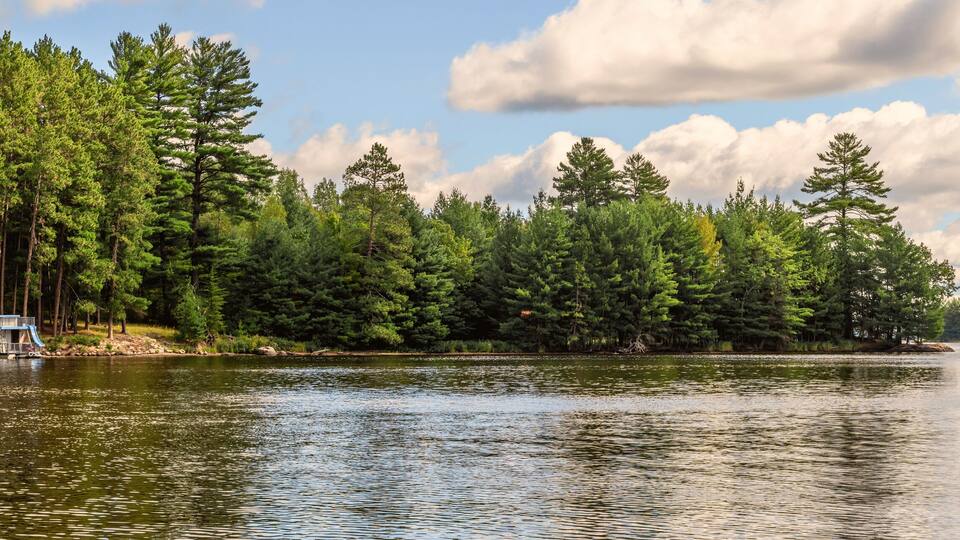 People are enjoying fishing and boating on a sunny day on Crane Lake, Voyageurs National Park, Minnesota