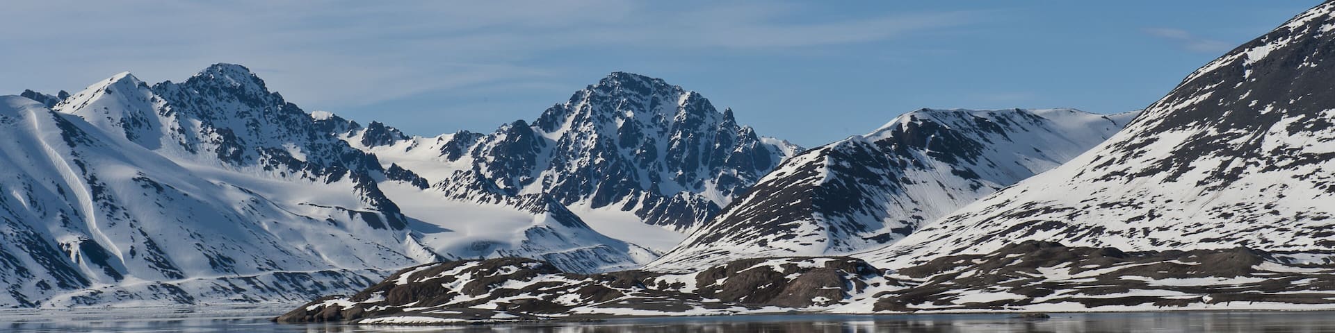 Reflections in water of Woodfjorden, Svalbard