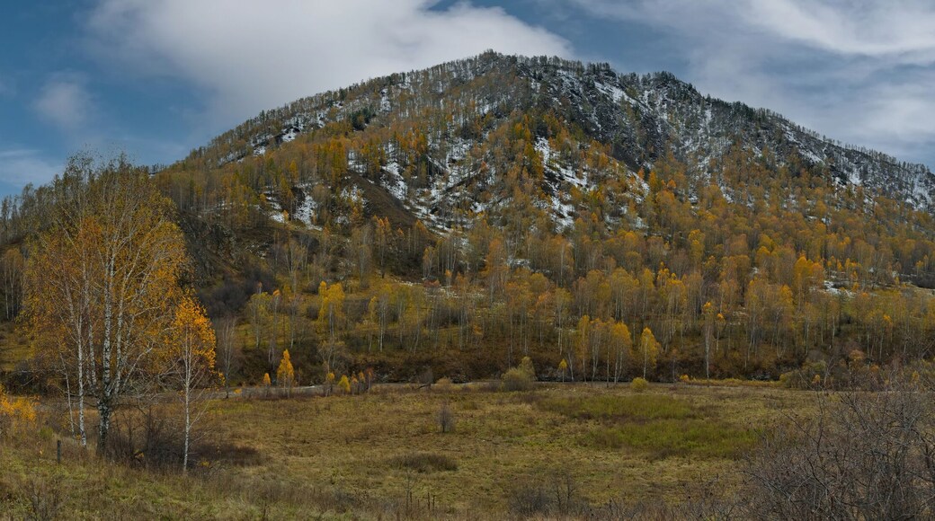 Russia. Western Siberia, Altai Mountains. A fascinating view of the autumn Altai mountains sprinkled with the first snow in the valley of the Chuya River.