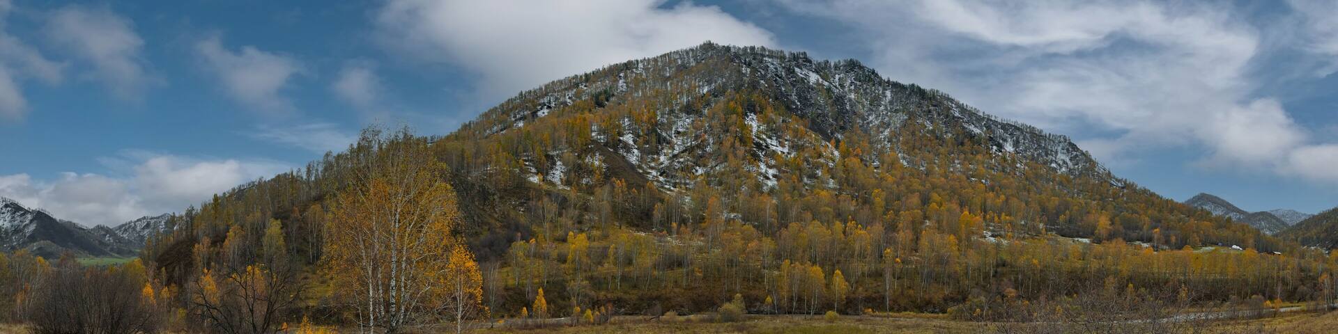 Russia. Western Siberia, Altai Mountains. A fascinating view of the autumn Altai mountains sprinkled with the first snow in the valley of the Chuya River.
