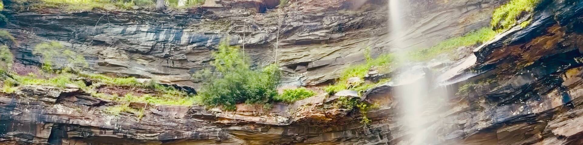 The scenic, stunning Kaaterskill Falls near North South Lake in NY tucked away within the Catskill Mountains. Stunning waterfall view, rocks to climb, water to swim in and and endless trails to hike.