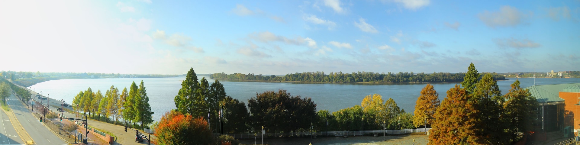 A river, trees, a basketball court, and a bridge.
