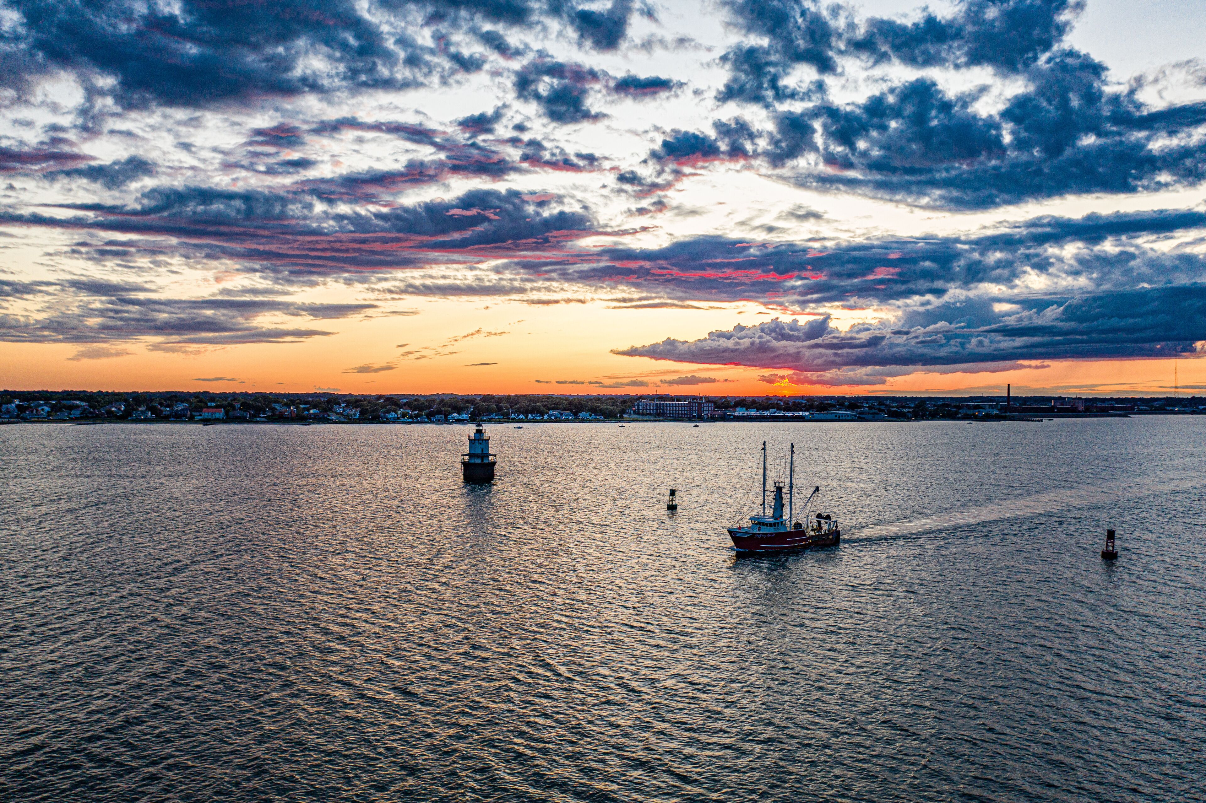 fishing boat heading out to sea