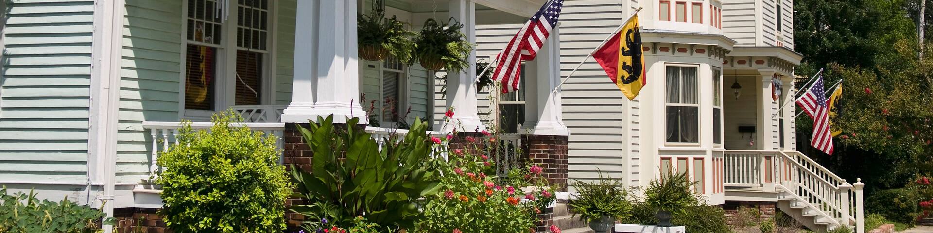 Residential street in New Bern North Carolina, they are flying the United States and New Bern Flags on the houses