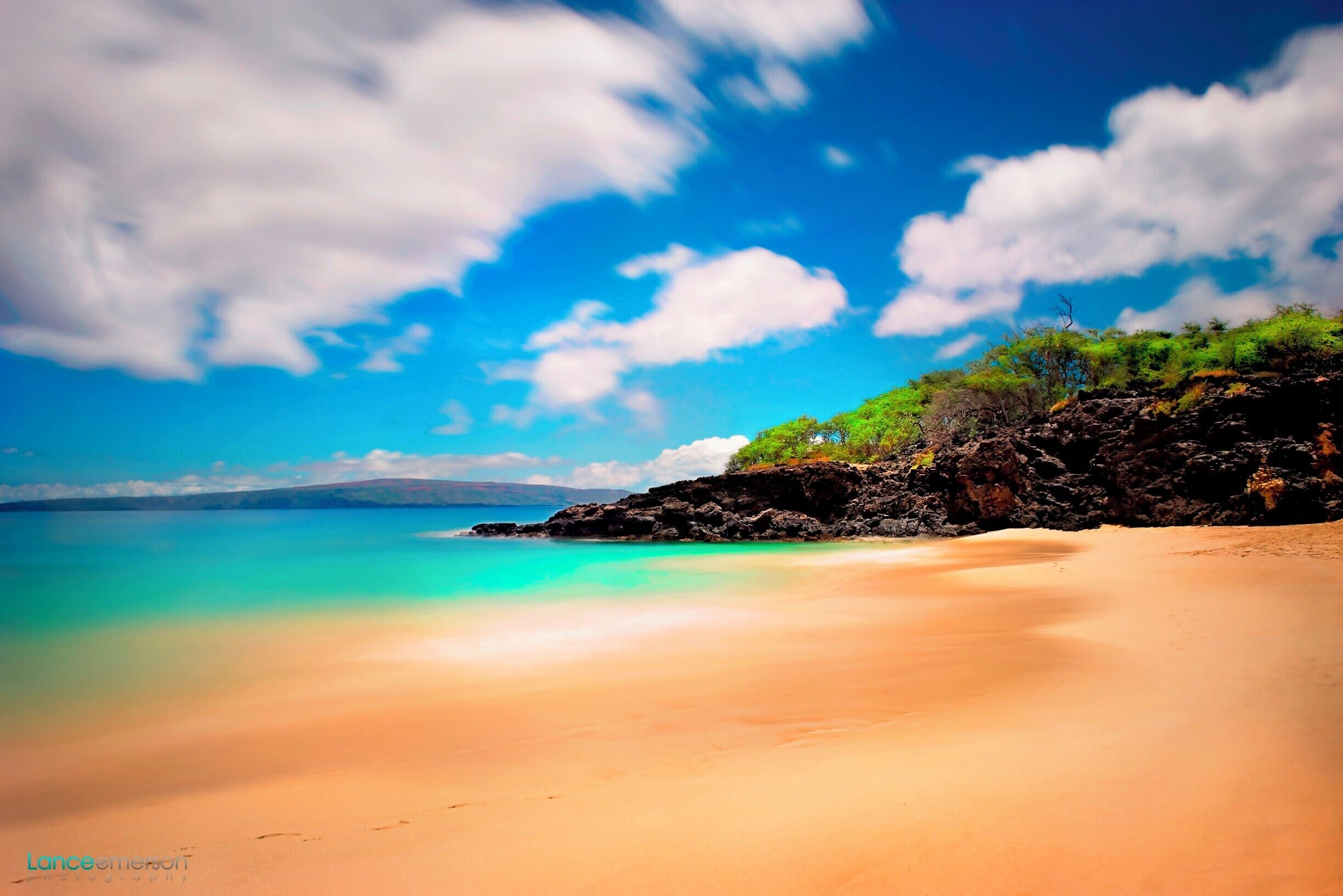 Favorite beach of all time with trees lining the beach from behind. Water is crystal clear and the shore break makes for some fun rides. If you are up for relaxing in the sun this is the spot to do it!
