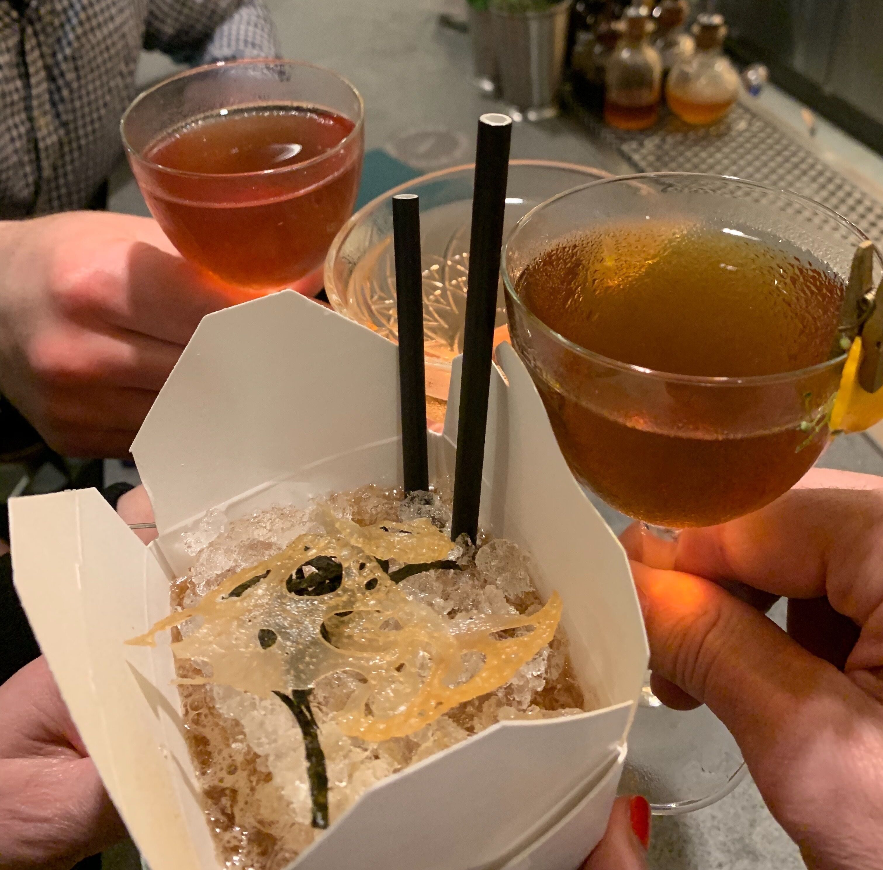 The bar at Lineage has friendly and creative bartenders.  This cocktail is in a to go container and has interesting garnishes.  Delicious food as well.