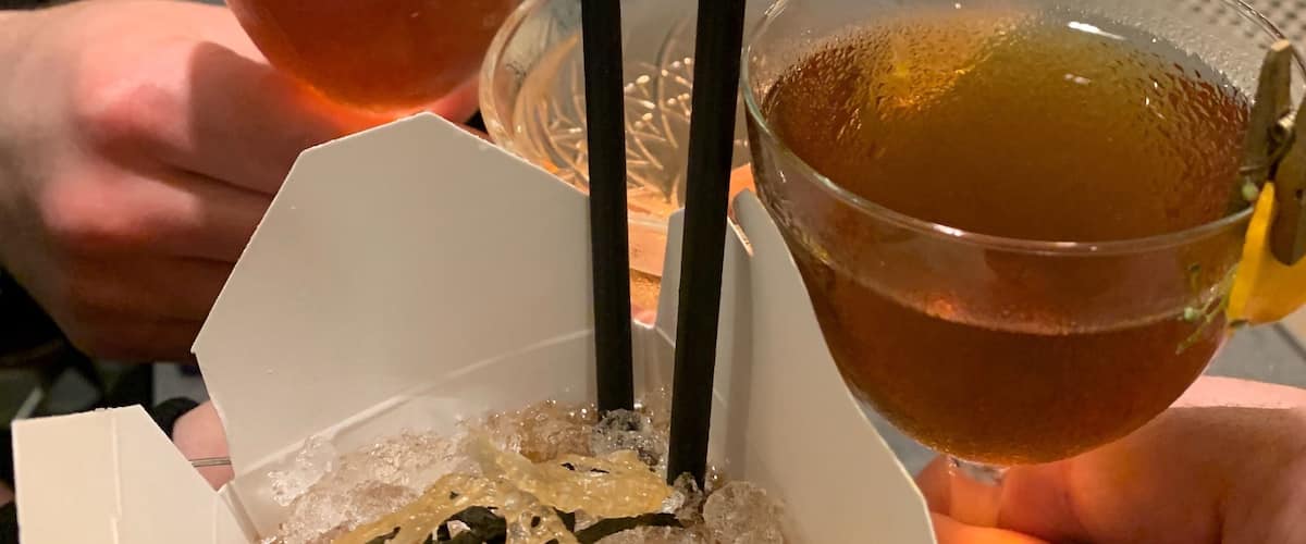 The bar at Lineage has friendly and creative bartenders.  This cocktail is in a to go container and has interesting garnishes.  Delicious food as well.