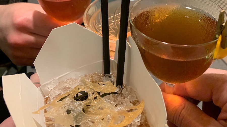 The bar at Lineage has friendly and creative bartenders. This cocktail is in a to go container and has interesting garnishes. Delicious food as well.