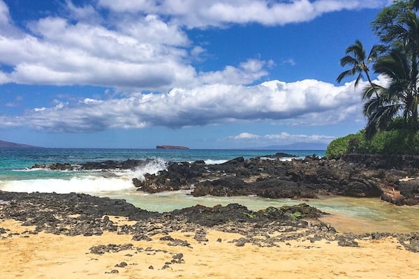 This beach is known as Secret Beach, but it isn't much of a secret. However, it's a beautiful spot tucked away behind a small opening in a rock wall and totally worth seeking out. A lot of couples choose to get married here at sunset, hence its other nickname of Wedding Beach.