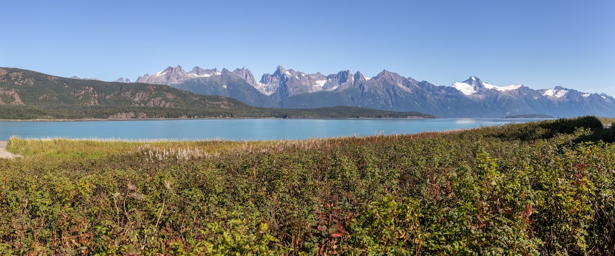 A lake with mountains in the background.